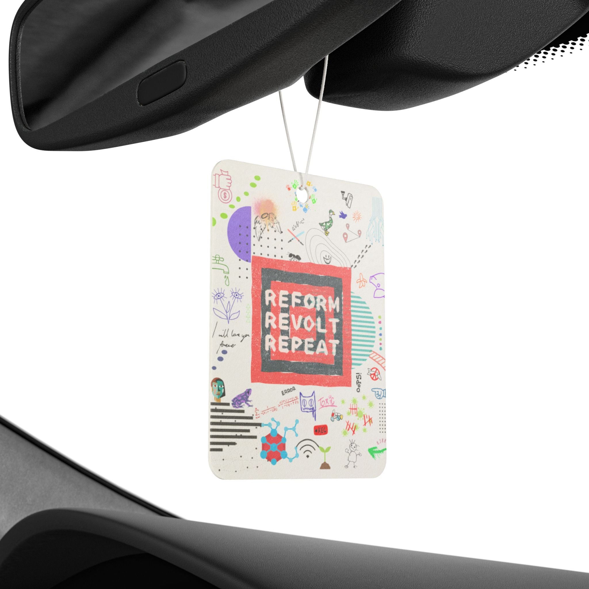 Car air freshener with colorful design hanging from a car's rearview mirror.